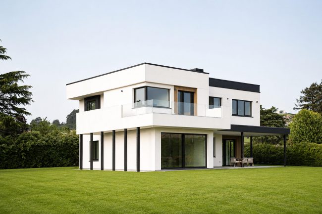 Casa unifamiliar aislada contemporánea con terraza, jardín y porche - Dolmen